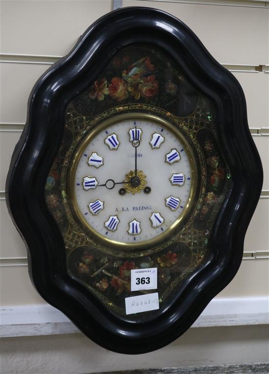 A mother of pearl inlaid wall clock by Griod A La Pallisse width 38cm height 50cm